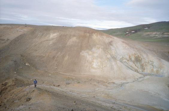 Gordon walking between the smaller crater and V�ti - the larger crater