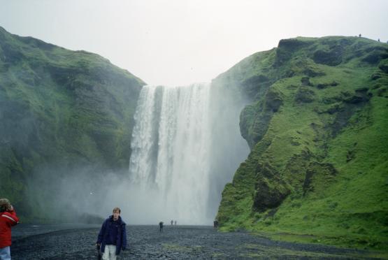 Dave in front of Sk�gafoss and the green surrounding hillside